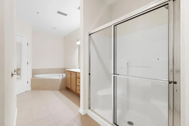 a bathroom with a bathtub and a shower