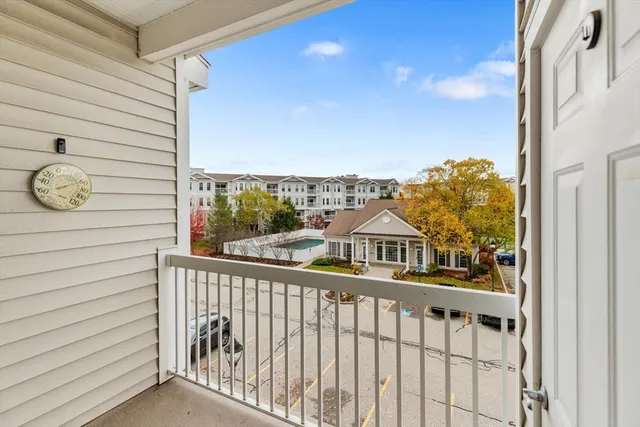 a view of a balcony with a flower plants