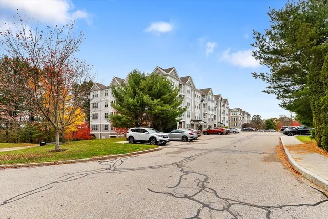 a view of a street with a building in the background