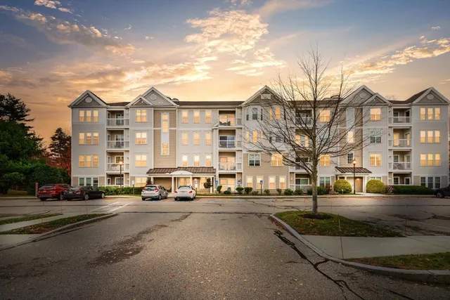 a city street lined with buildings and cars