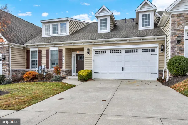 a view of a house with backyard and porch
