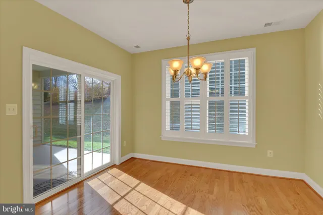 a view of an empty room with windows