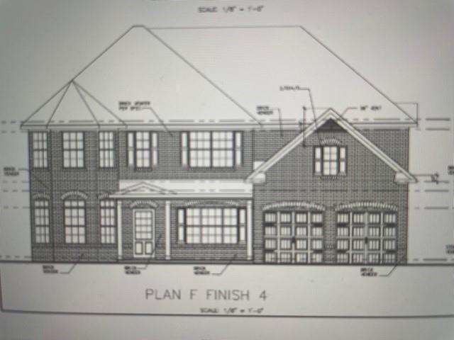 75 Greenwich Drive Covington, GA 30016 - Photo 1 of 1 a view of a brick house with large windows