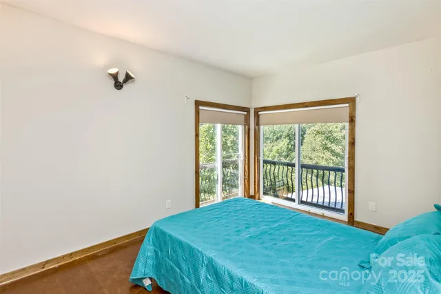 a bedroom with a bed and a desk