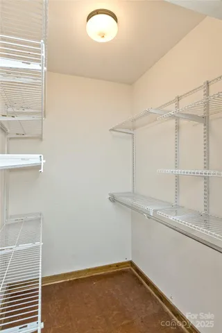 a bathroom with a granite countertop sink and a window