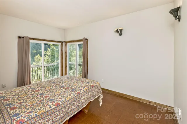 a bedroom with a bed and chair