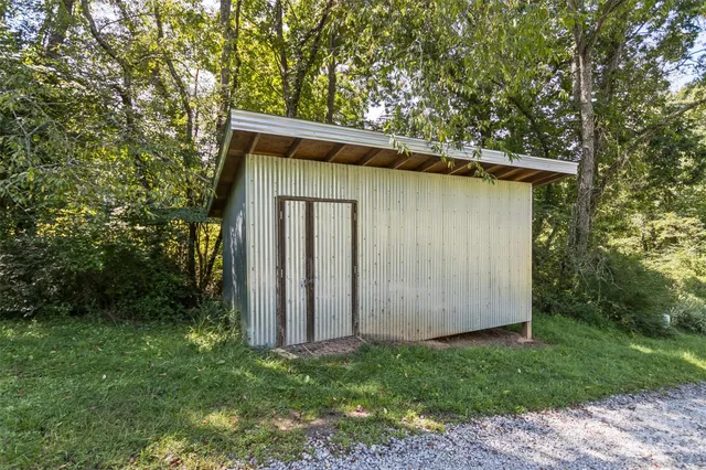 a view of a balcony with wooden floor and fence