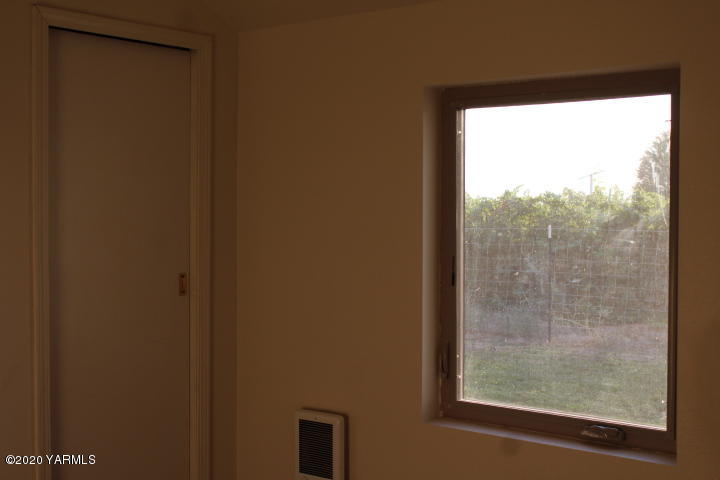 440 Gurley Road Granger, WA 98932 - Photo 13 of 25 a view of a room that has a window