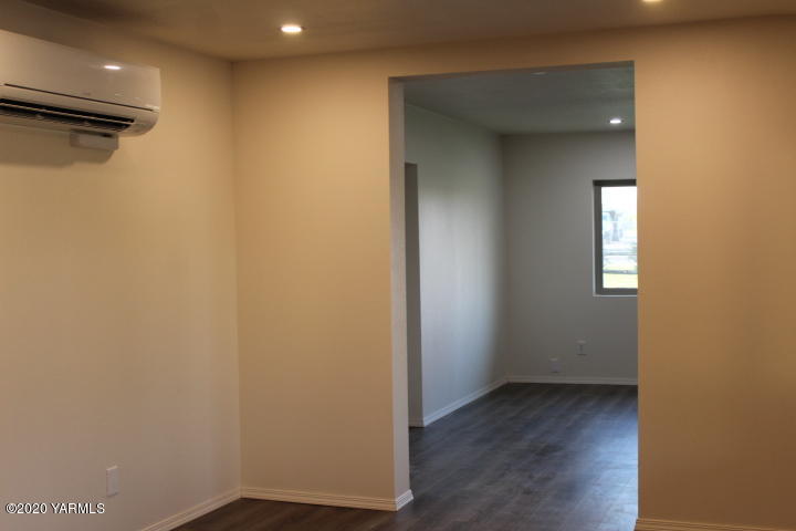 440 Gurley Road Granger, WA 98932 - Photo 6 of 25 a view of a hallway with wooden floor