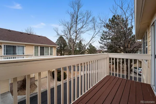 a view of a wooden deck and a yard