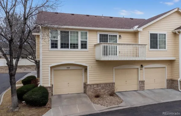 a front view of a house with garage