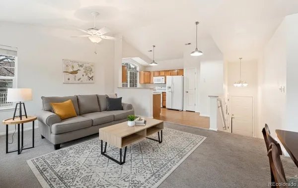 a living room with furniture and a rug