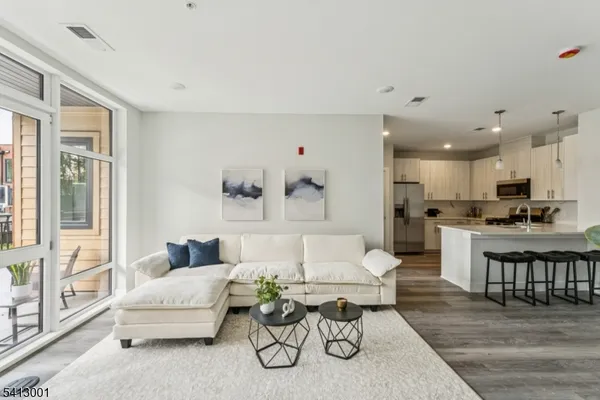 a living room with furniture and a large window