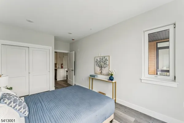 a bedroom with a bed and a table in it