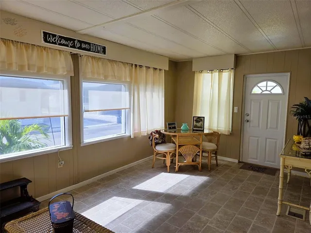 a view of a dining room with furniture window and outside view