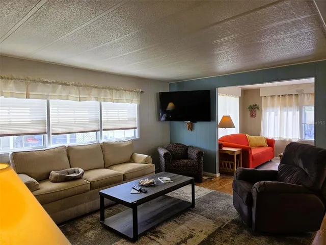 a metallic refrigerator freezer sitting in a kitchen