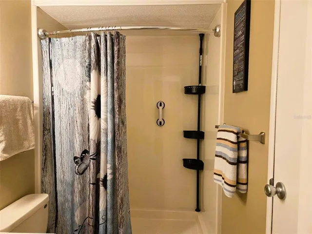 a view of a room with chairs and tables