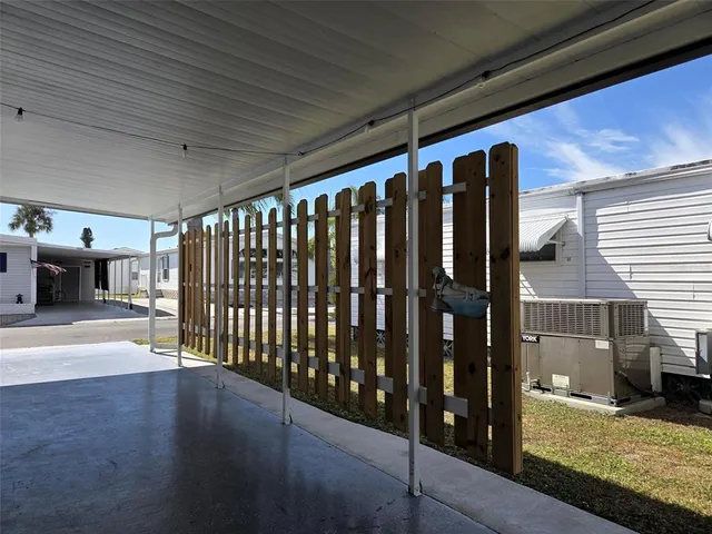 a view of a swimming pool with outdoor seating