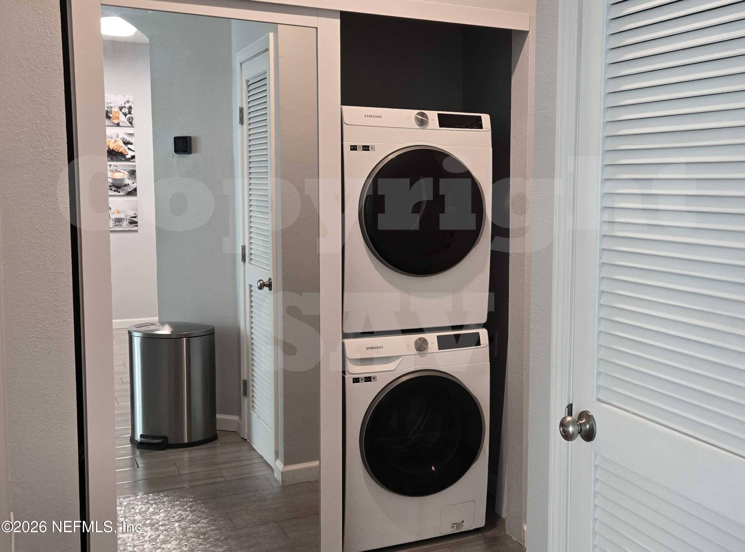 10550 Baymeadows Road, Unit 522 Jacksonville, FL 32256 - Photo 15 of 25 a view of a hallway with washer and dryer