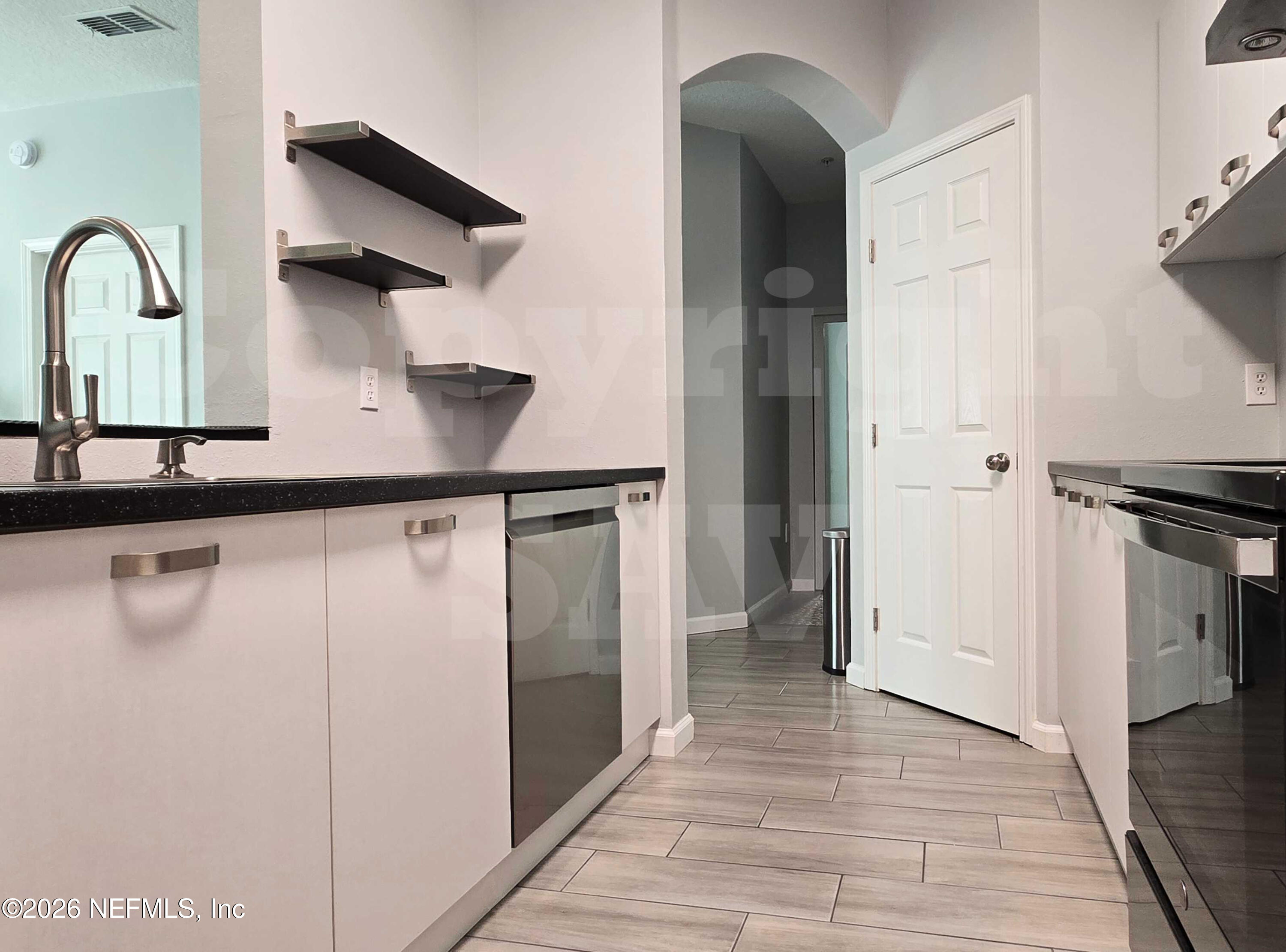 10550 Baymeadows Road, Unit 522 Jacksonville, FL 32256 - Photo 18 of 25 a view of an entryway with wooden floor