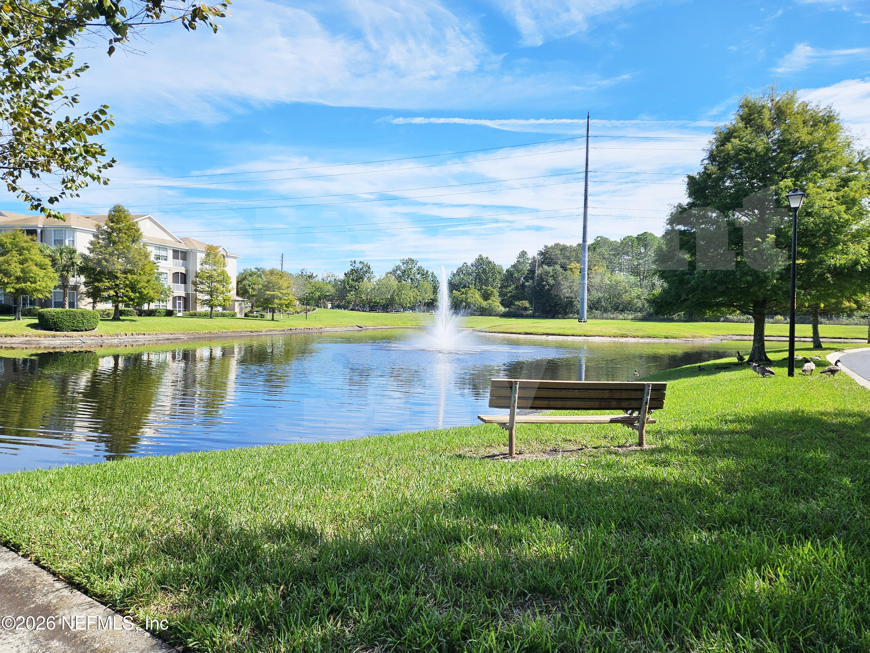 10550 Baymeadows Road, Unit 522 Jacksonville, FL 32256 - Photo 24 of 25 a view of a lake with a park