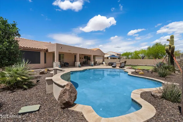 a view of a swimming pool with a patio