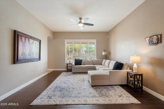 a living room with furniture and a rug