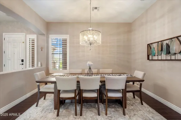 a dining room with furniture and window