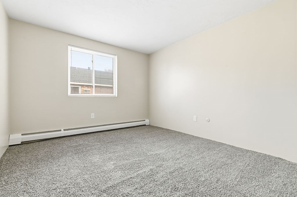 1801 Ocean Street, Unit B31 Marshfield, MA 02050 - Photo 12 of 17 an empty room with a window