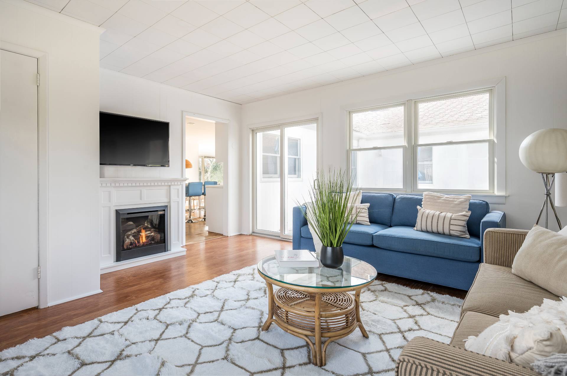 25 Lynncliff Road Hampton Bays, NY 11946 - Photo 11 of 24 a living room with furniture a fireplace and window