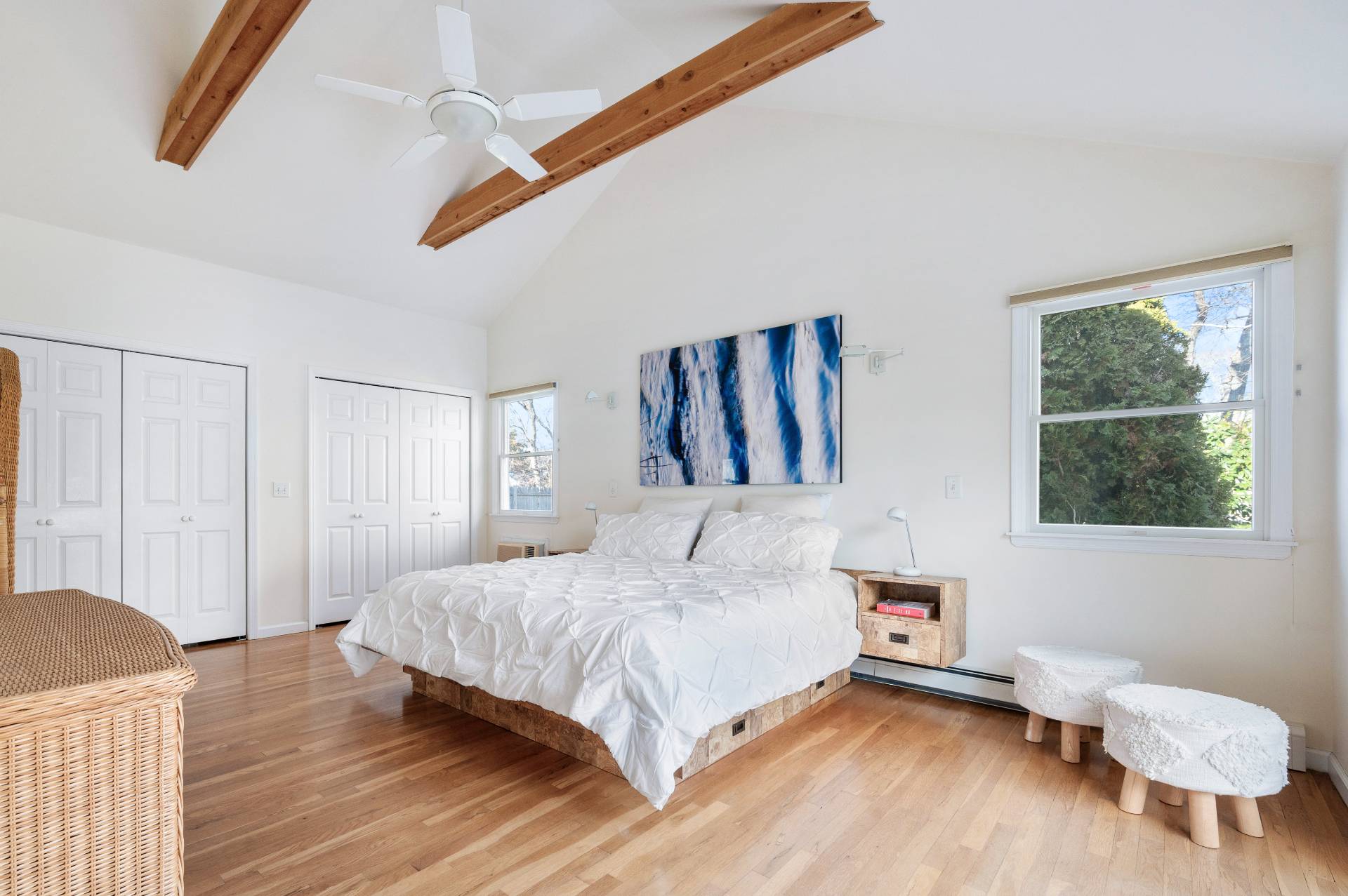 25 Lynncliff Road Hampton Bays, NY 11946 - Photo 12 of 24 a bedroom with a bed and wooden floor