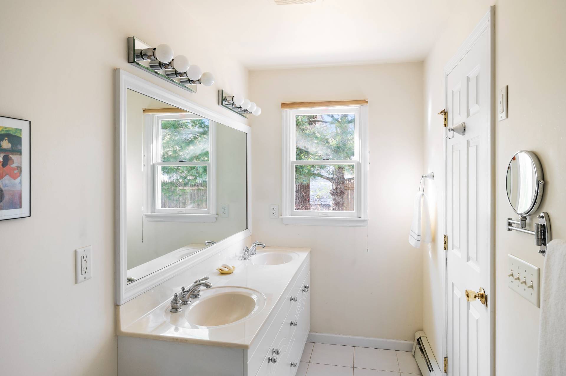 25 Lynncliff Road Hampton Bays, NY 11946 - Photo 14 of 24 a bathroom with a sink and a window