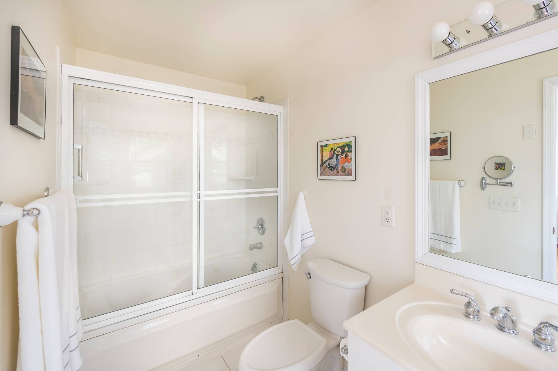 25 Lynncliff Road Hampton Bays, NY 11946 - Photo 15 of 24 a bathroom with a sink a toilet and shower