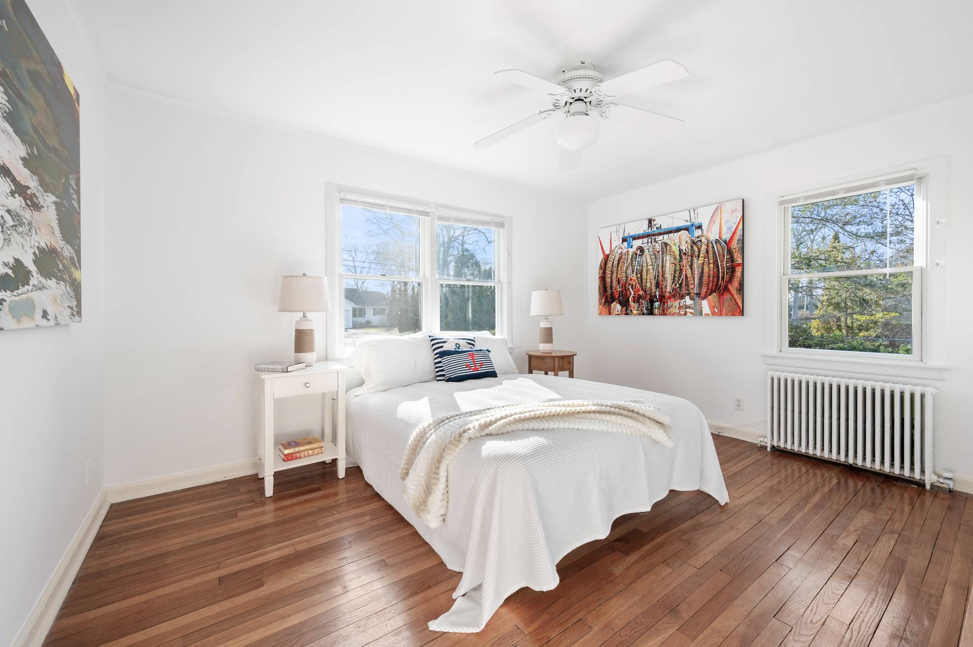 25 Lynncliff Road Hampton Bays, NY 11946 - Photo 16 of 24 a bedroom with a bed and a window