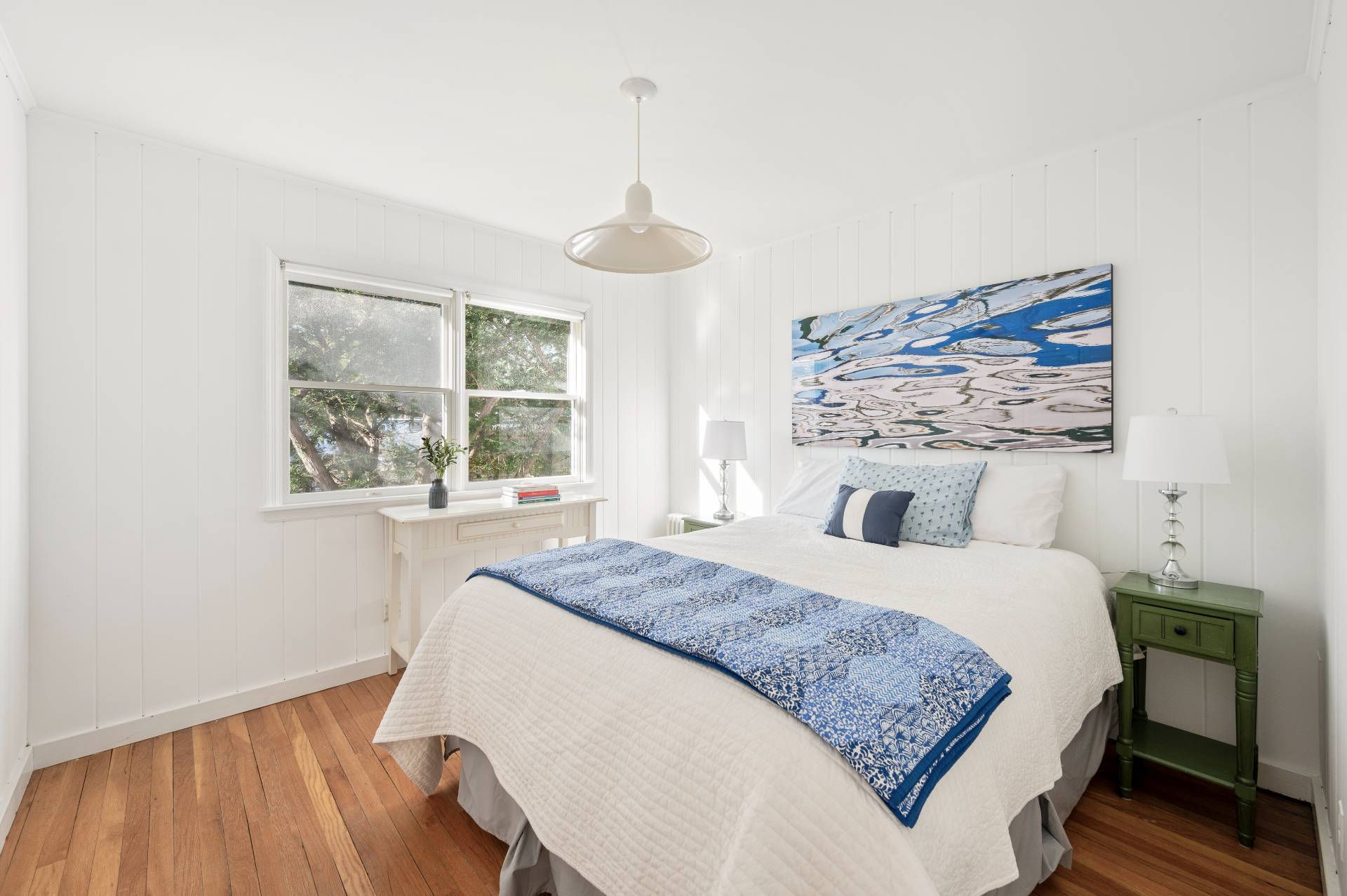 25 Lynncliff Road Hampton Bays, NY 11946 - Photo 17 of 24 a bedroom with a large bed and a window