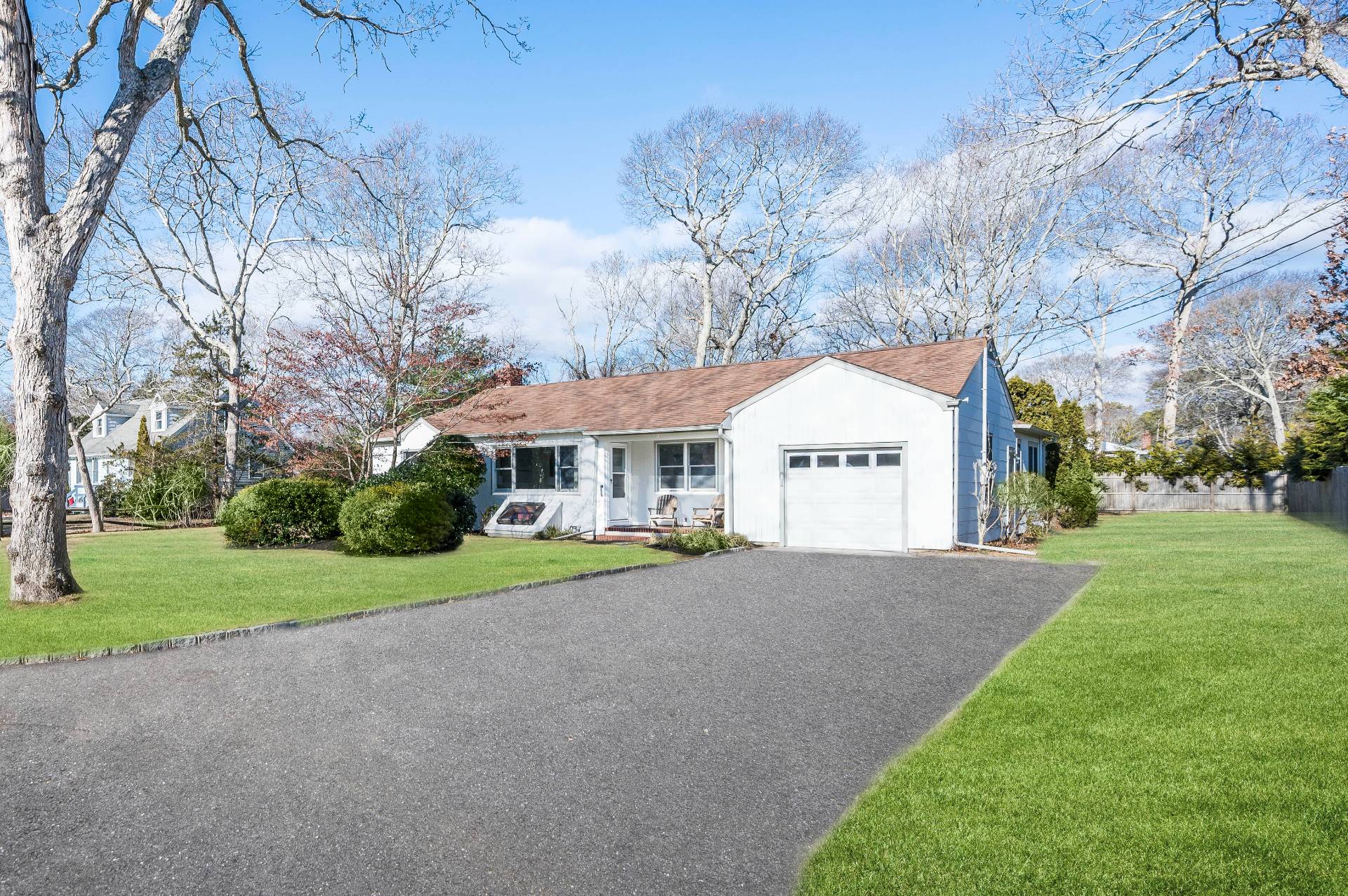 25 Lynncliff Road Hampton Bays, NY 11946 - Photo 2 of 24 a view of a house with a yard and pathway