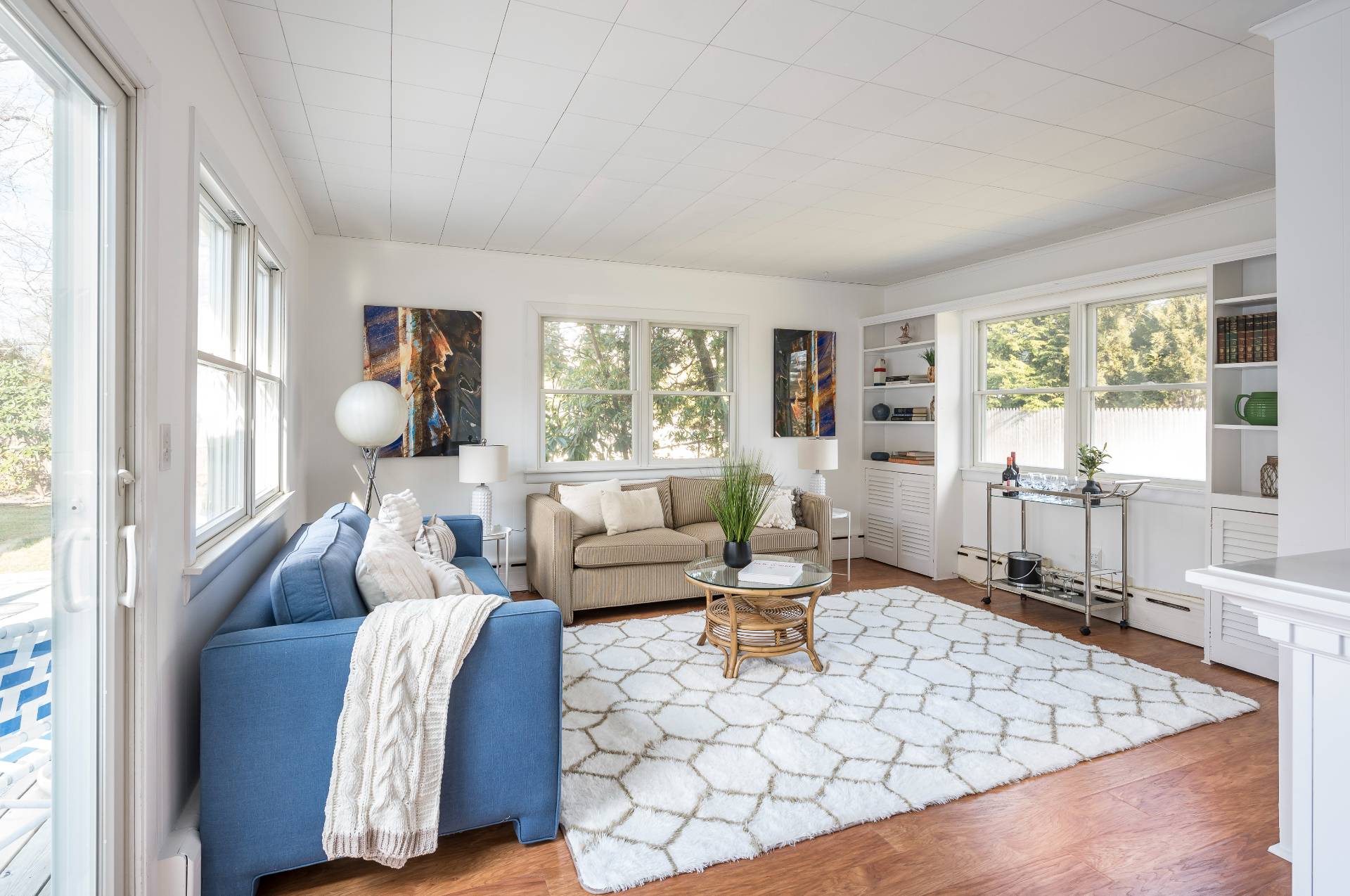 25 Lynncliff Road Hampton Bays, NY 11946 - Photo 10 of 24 a living room with furniture and a large window