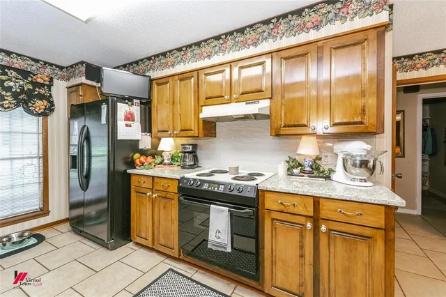 a dining room with furniture and chandelier fan