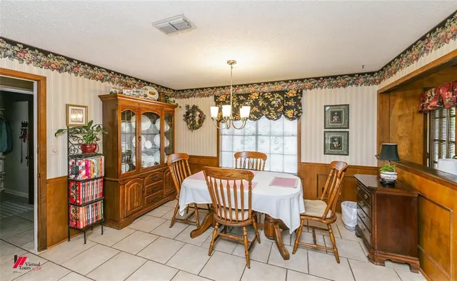 a patio with a table and chairs