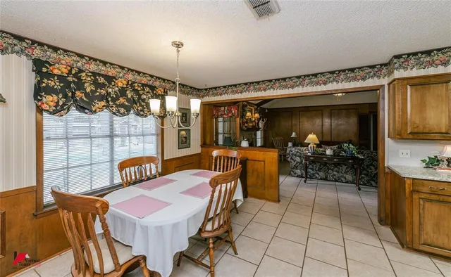 a large white kitchen with a window