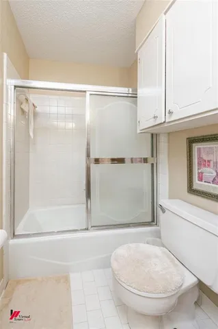a bathroom with a sink toilet and a mirror