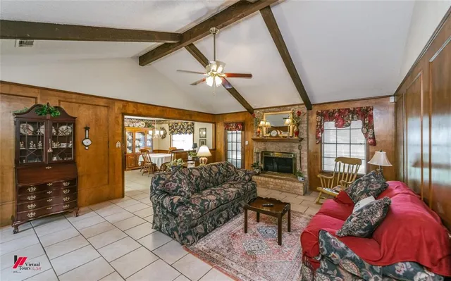 a bathroom with a granite countertop sink a mirror and shower