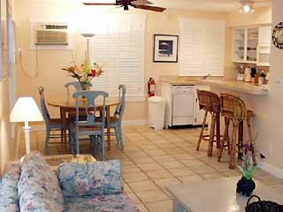 921 Center Street, Unit 1 Key West, FL 33040 - Photo 4 of 7 a view of a dining room with furniture and a chandelier