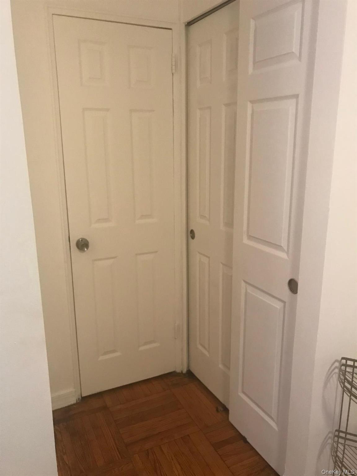 1332 Metropolitan Avenue, Unit 2A Bronx, NY 10462 - Photo 14 of 15 an empty room with wooden floor