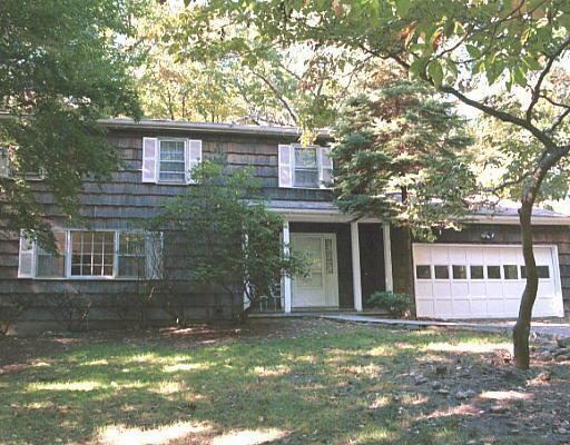 74 Don Bob Road Stamford, CT 06903 - Photo 1 of 1 a view of a house with backyard and a tree