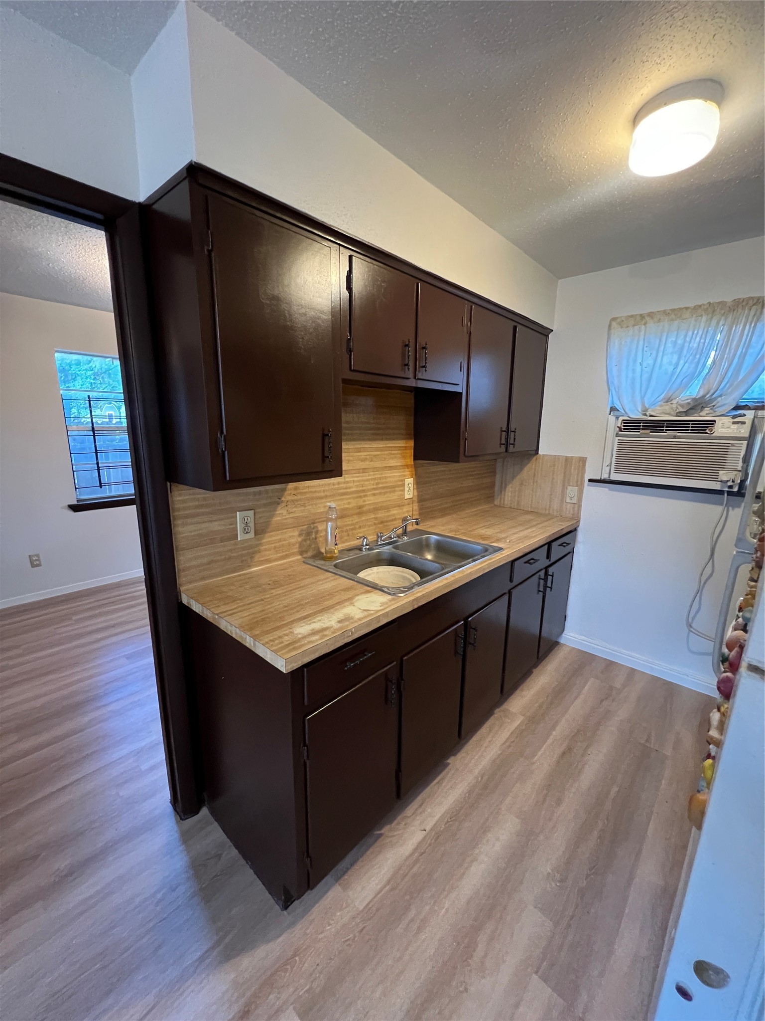 2501 Cleburne Street, Unit 1 Houston, TX 77004 - Photo 4 of 7 a kitchen with stainless steel appliances granite countertop a stove and a wooden floors