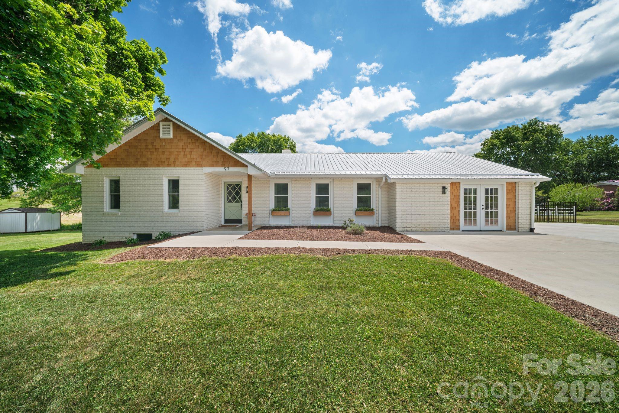 97 Paul Holland Road Canton, NC 28716 - Photo 1 of 35 a front view of house with yard and green space