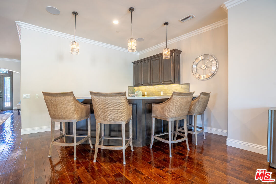 2510 Belleview Road Upland, CA 91784 - Photo 22 of 75 a view of a dining room with furniture and wooden floor