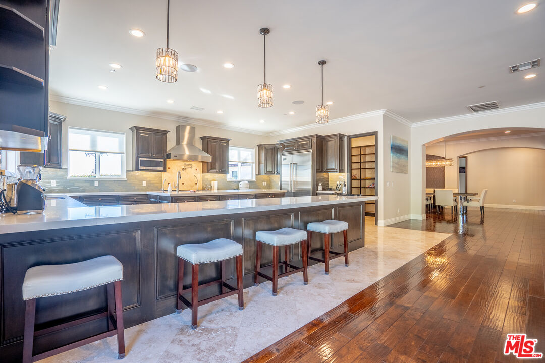 2510 Belleview Road Upland, CA 91784 - Photo 25 of 75 a large kitchen with a table and chairs