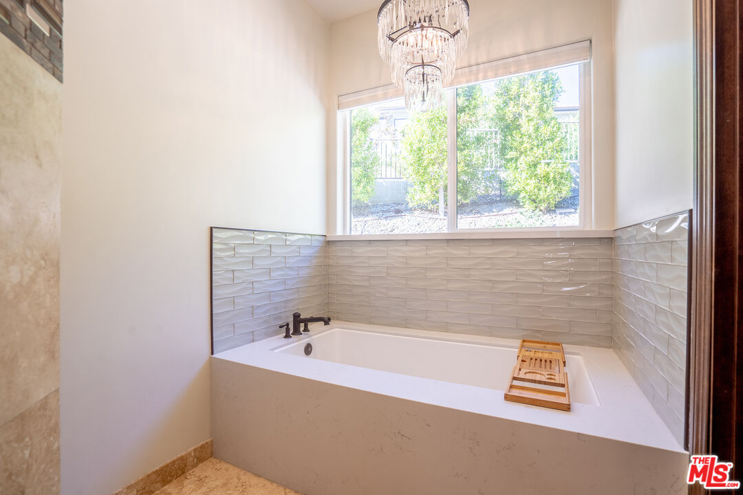 2510 Belleview Road Upland, CA 91784 - Photo 48 of 75 a bath tub sitting in a bathroom next to a window